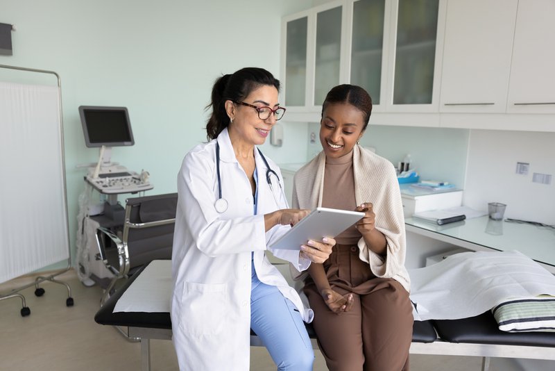 Woman and her primary care provider talking